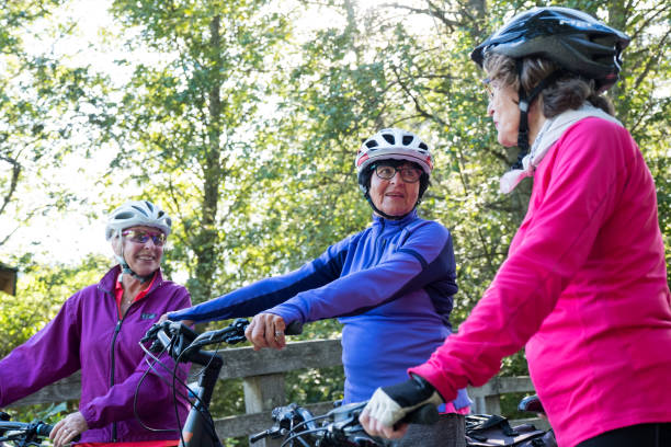istock Active seniors with the bicycles on a paved trail 1184294771
