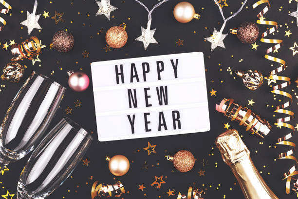 istock New Year composition with confetti, decorations and champagne. 1184307159