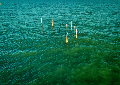 Aerial drone image of the remains of an old fishing pier after it was destroyed in a recent hurricane on the South Carolina Coast