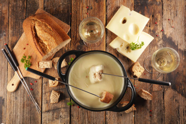 istock cheese fondue with wine and bread, top view 1184316319
