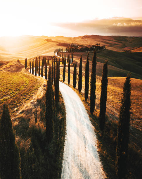 winding road in italy winding road in italy crete senesi stock pictures, royalty-free photos & images