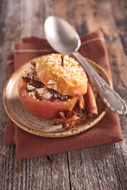 istock baked apple with syrup and nuts 1184317512