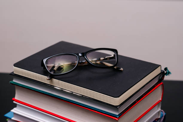 istock Stack of books with a pair of glasses 1184319627