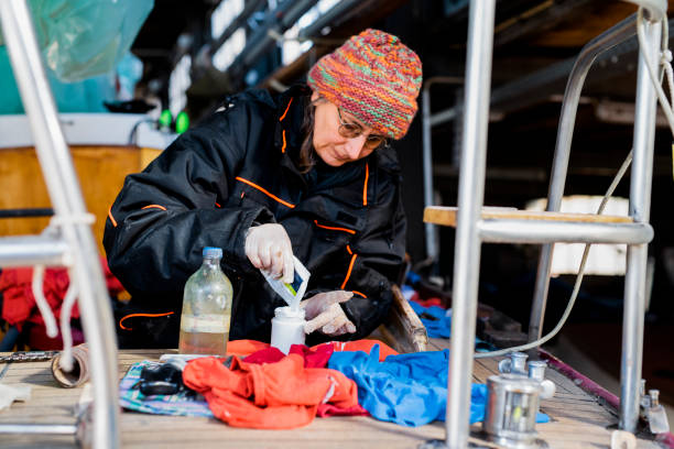 istock Boat maintenance, woman working on sailboat deck 1184320958