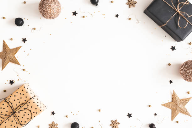 istock Christmas composition. Gift box, beige and black decorations on white background. Christmas, winter, new year concept. Flat lay, top view, copy space 1184322028