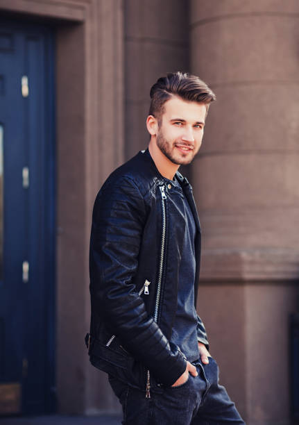 istock man in leather jacket posing in city 1184323553