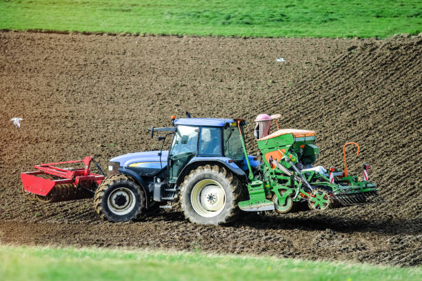istock farmer in his tractor making plantations in autumn 1184325485