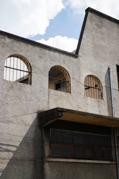 istock Old concrete grunge wall of building 1184325585
