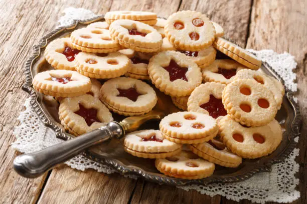 Linzer cookies with jam on a plate on the table. Traditional Austrian biscuits filled. horizontal