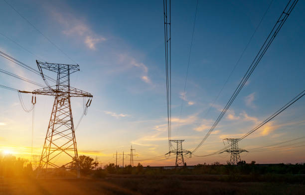 istock distribution electric substation with power lines and transformers, at sunset. 1184328457