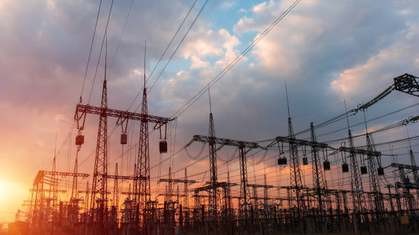 istock Electrical substation silhouette on the dramatic sunset background 1184328494