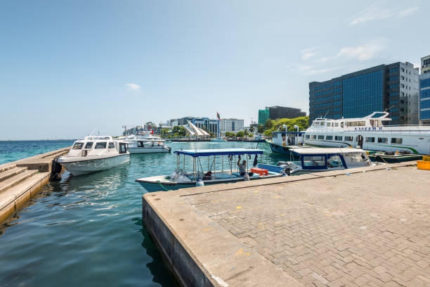 Berth near the fruit and fish market in Male, Maldives Male, Maldives - November 18, 2017: Water front of Male city as seen from the Vegetable and Fish Market in Maldives. maldives fish market photos stock pictures, royalty-free photos & images