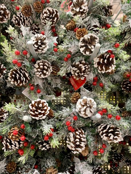 istock Christmas decoration wreath with cones and fir tree branches 1184329685