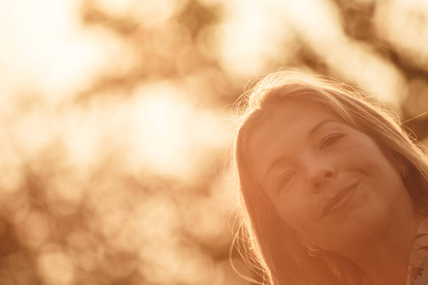 Portrait of a blond haired woman looking at the camera