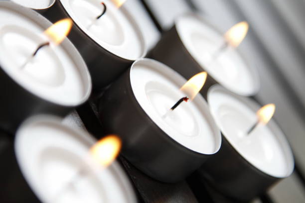 istock Tea lights on a wooden bench 1184336432