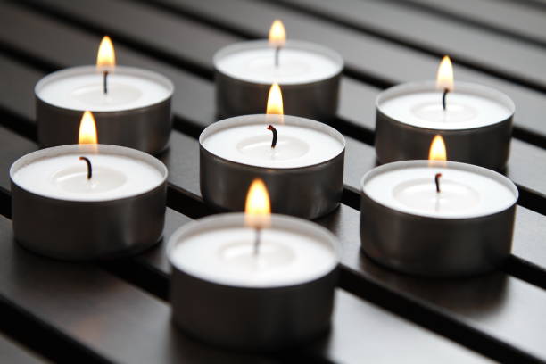 istock Tea lights on a wooden bench 1184336577