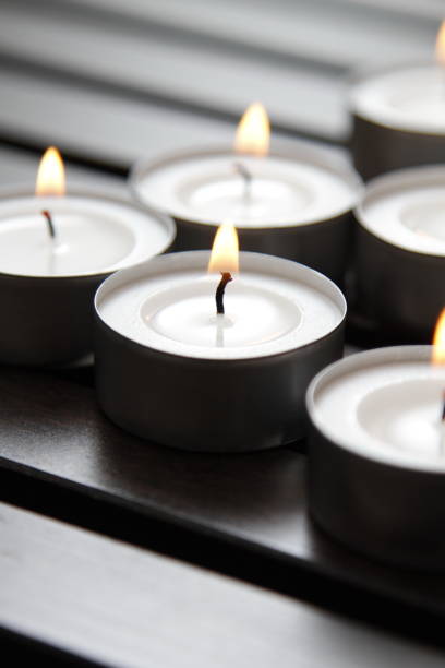 istock Tea lights on a wooden bench 1184337263