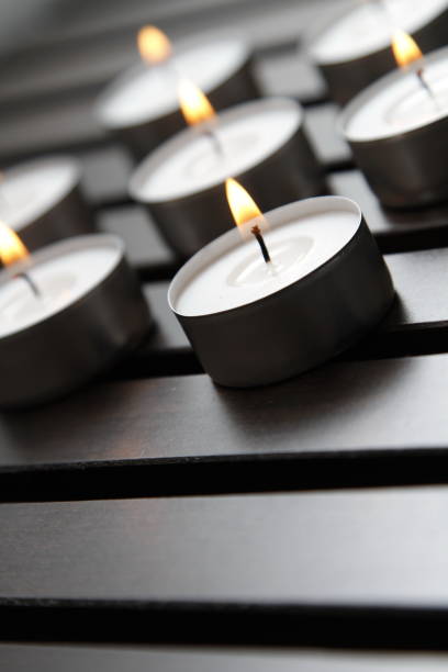 istock Tea lights on a wooden bench 1184337337