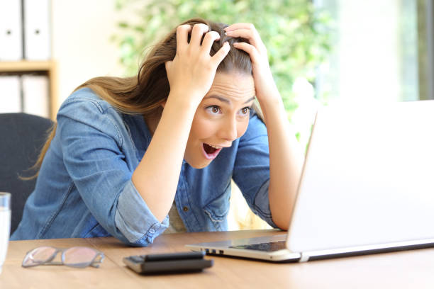 istock Amazed woman finding online surprising content on laptop 1184340632