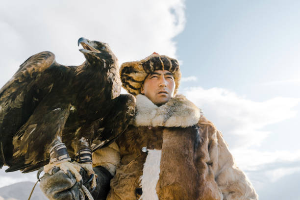 istock Portrait of eagle hunter standing in desert in Mongolia 1184341241