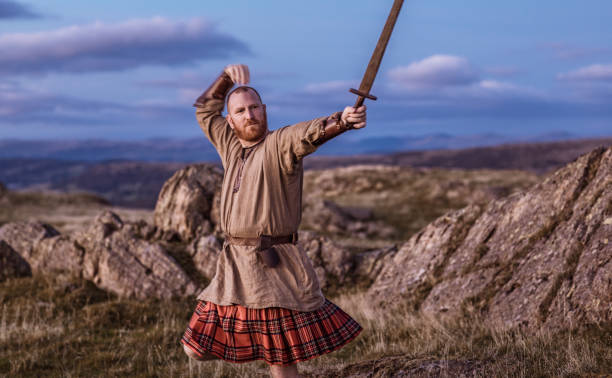 istock Scottish Redhead Warrior wearing a kilt 1184343690