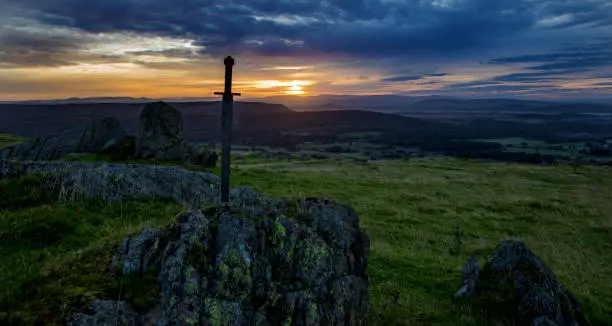Sword in the stone at dawn in the beautiful countryside landscape in the north of England on a beautiful day in September