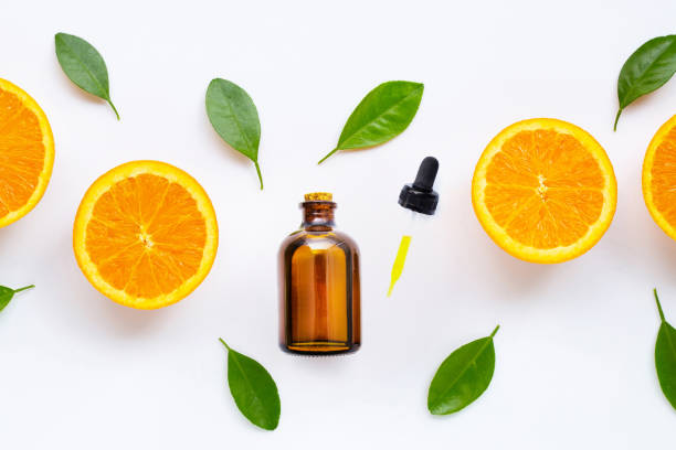 istock Citrus essential oil with fresh orange fruit isolated on white 1184346930