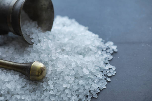 istock Large sea salt. Spice. Mortar and pestle for grinding. 1184349737