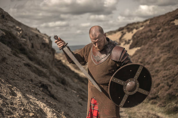 istock Scottish Redhead Warrior wearing a kilt 1184350468