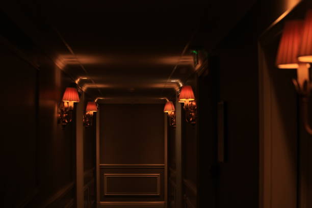 istock Dark Hotel Corridor with Lamps 1184353256