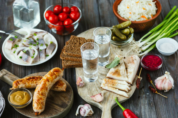 istock Vodka and traditional snack on wooden background 1184353422