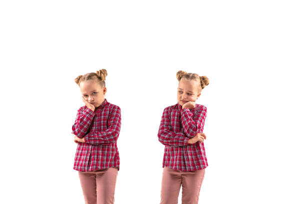 istock Young handsome girl arguing with herself on white studio background. 1184353689