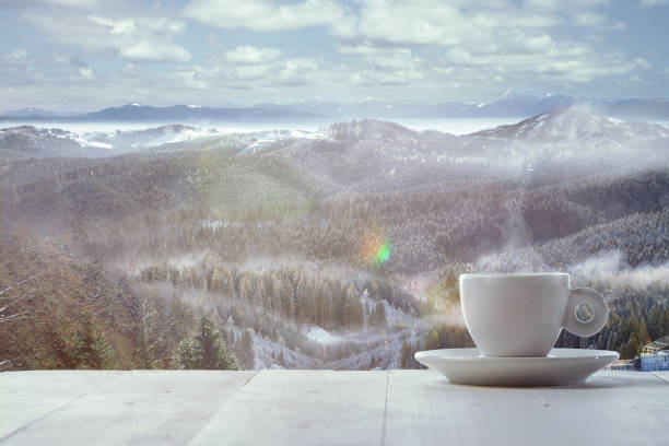 istock Single tea or coffee mug and landscape of mountains on background 1184354797
