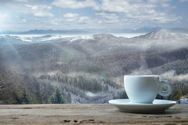 istock Single tea or coffee mug and landscape of mountains on background 1184354803