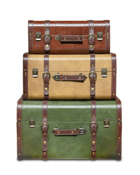 three stacked vintage suitcases isolated from white background, Contains clipping path for transparent background