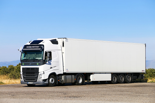 Aragon, Spain - September 9, 2019: White semi-trailer truck Volvo FH12.500 at the interurban road.