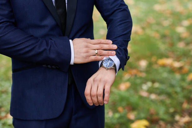 istock A watch on the groom's hand. 1184359763