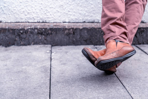 istock Standing leg with brown leather feet classic 1184359813