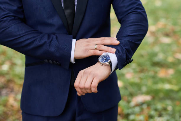 istock A watch on the groom's hand. 1184359821