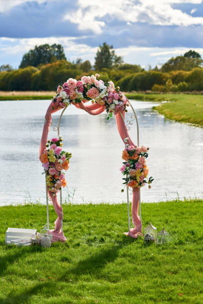 istock Wedding arch by the water. 1184359901