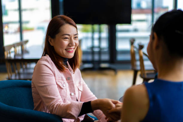 istock Asian woman executives doing a business handshake. 1184361314