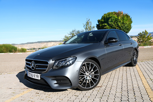 Aragon, Spain - September 9, 2019: Grey saloon car Mercedes-Benz E220d (W213) at the interurban road.