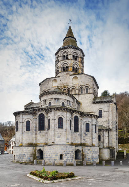 Basilica Notre Dame d'Orcival, France Notre-Dame Basilica is a Romanesque Auvergnat church located in Orcival, France orcival stock pictures, royalty-free photos & images