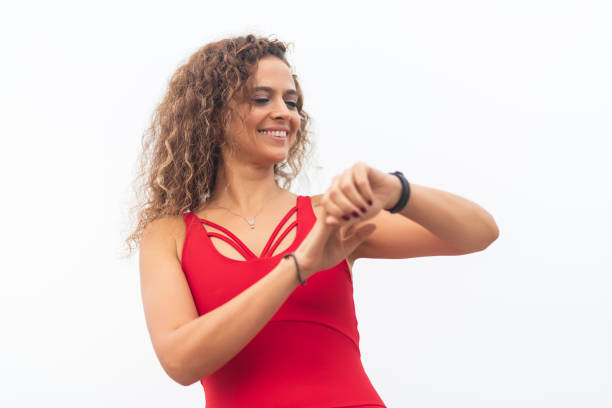 istock Athletic woman checking the time on wristwatch 1184362601