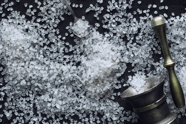 istock Large sea salt. Spice. Mortar and pestle for grinding. 1184362649