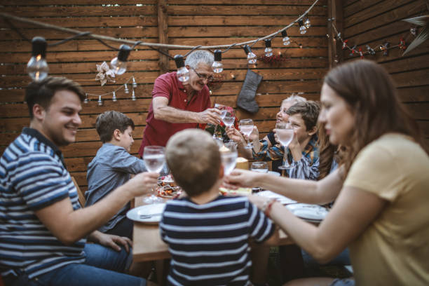 istock Multi generation family toasting for Christmas Eve 1184363480