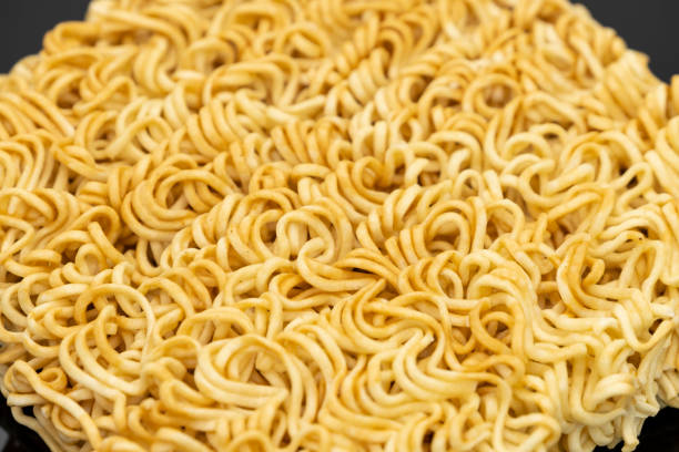 istock Raw instant noodle ready to cook for background texture design 1184364200