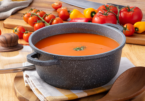 tomato soup on the wooden background