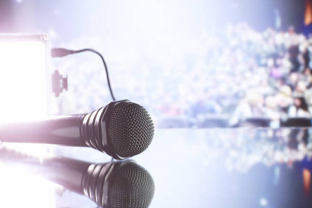 istock The microphone on the stage in front of the hall. Performance on stage. 1184365842