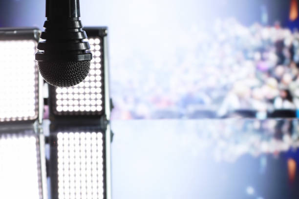 istock The microphone on the stage in front of the hall. Performance on stage. 1184365882
